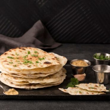 delicious-roti-arrangement-table_23-2149033983-1